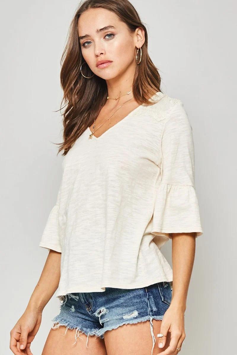 A Knit Top With Deep V Neckline And Yoke Design - Boutique Fashionistah